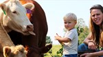 April Patterson and son by cattle