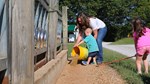 Caroline Holt and kids feeding 